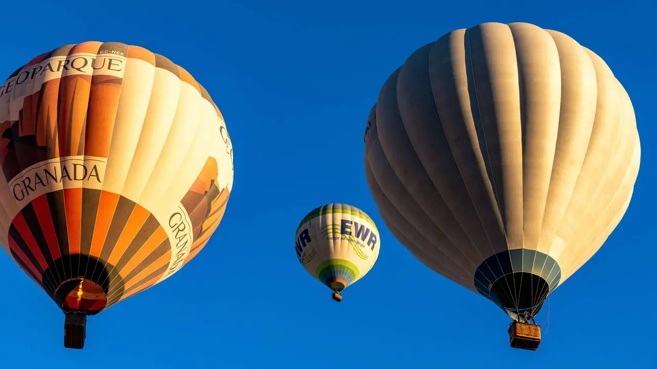 http://www.dreamstime.com/stock-photos-three-hot-air-balloons-ascending-clear-blue-sky-guadix-granada-spain-ascend-including-one-reading-geoparque-image343832543